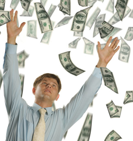 The young businessman falling dollars. It is isolated on a white background